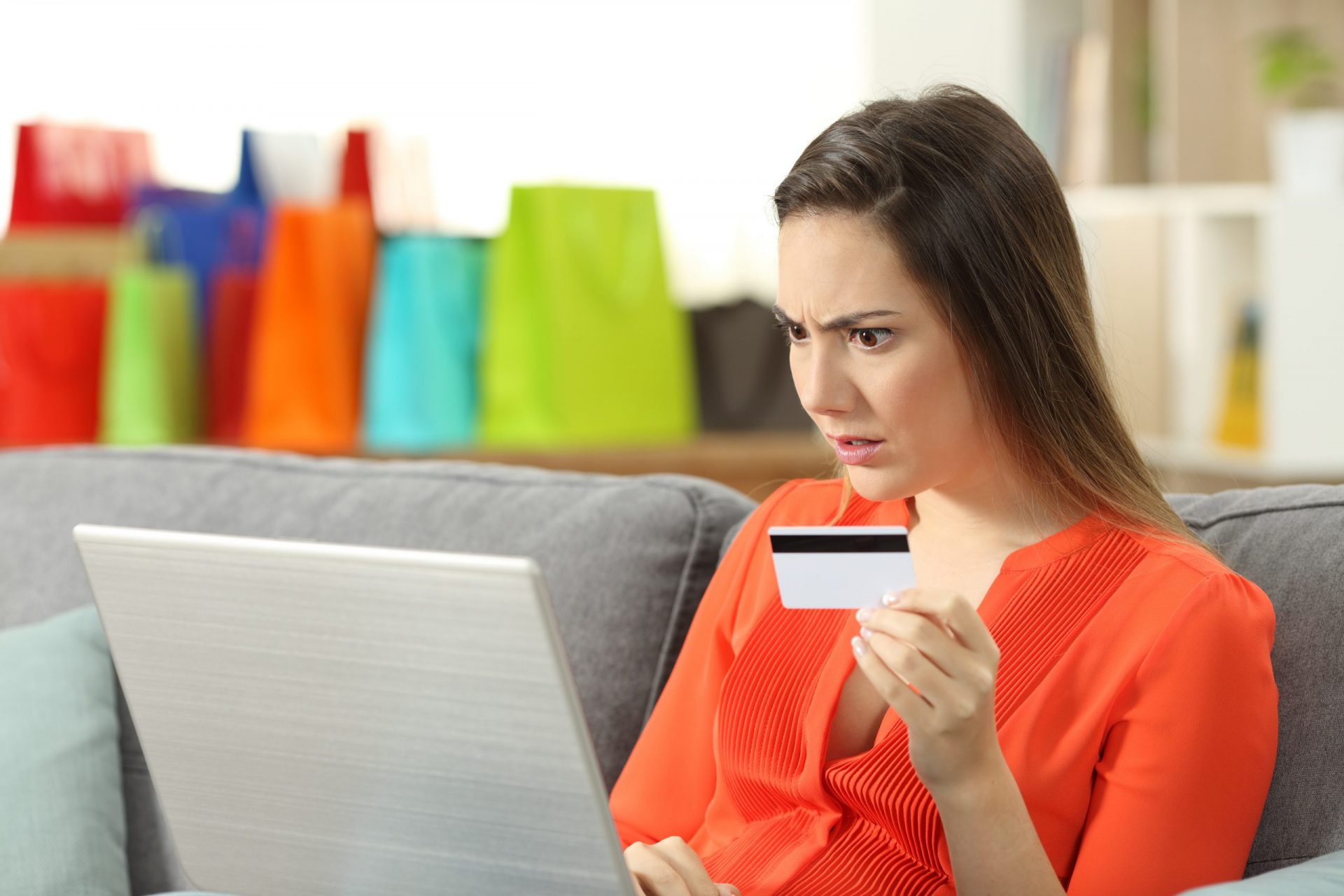 Shocked shopper buying online with credit card