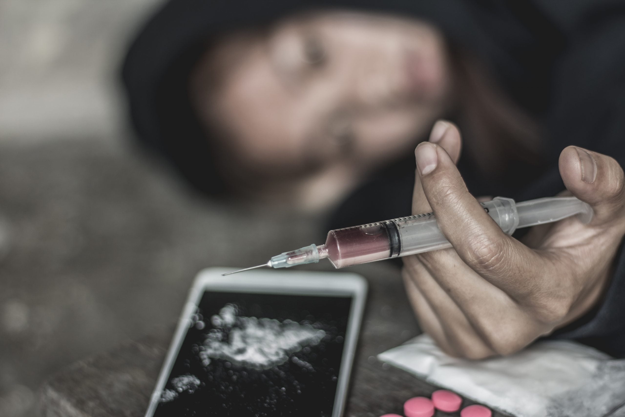 The woman holding the syringe and overdose, The concept of crime